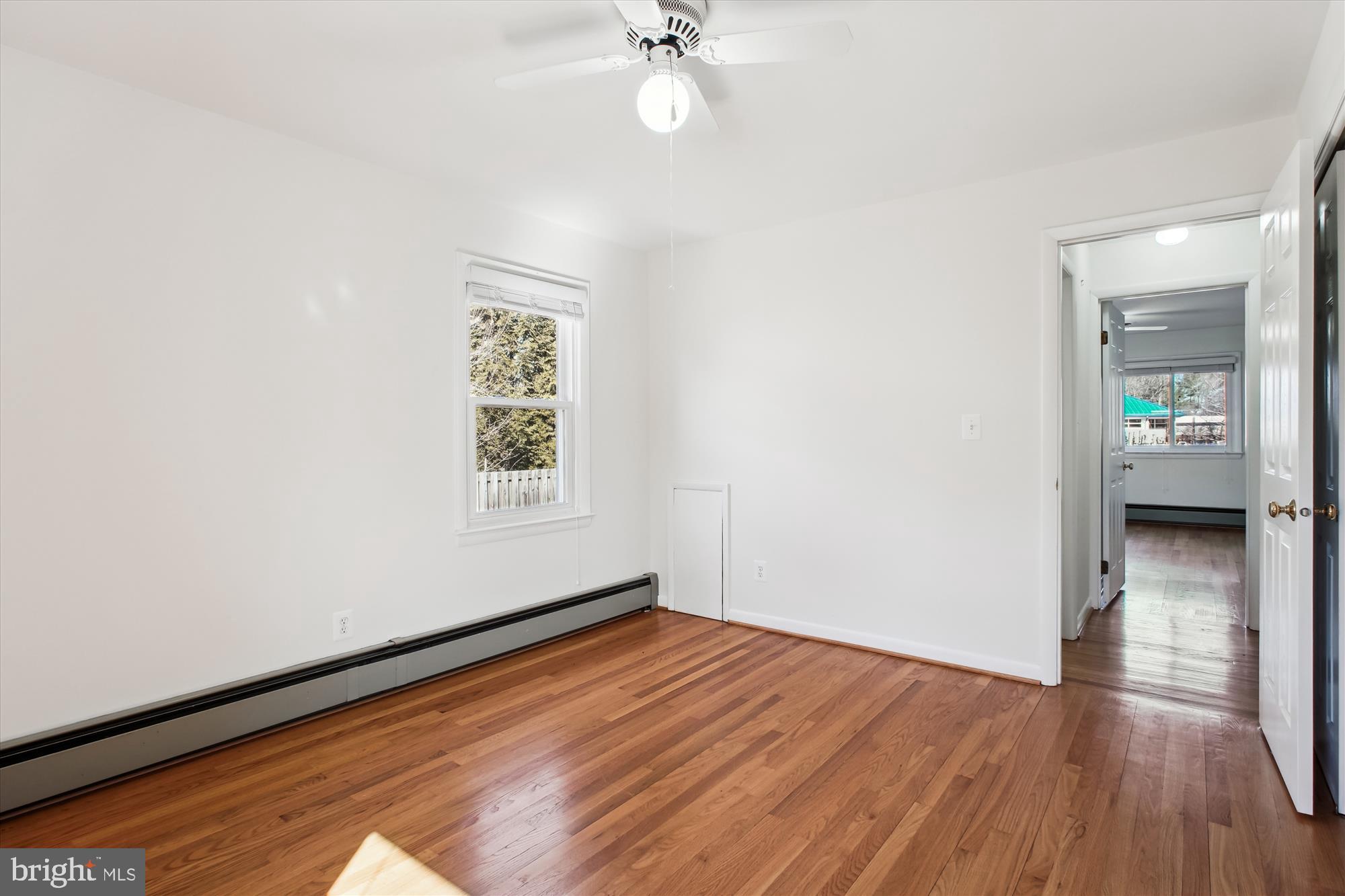 10607 Judicial Drive Fairfax, VA 22030 - Photo 46 of 60 wooden floor in an empty room with a window