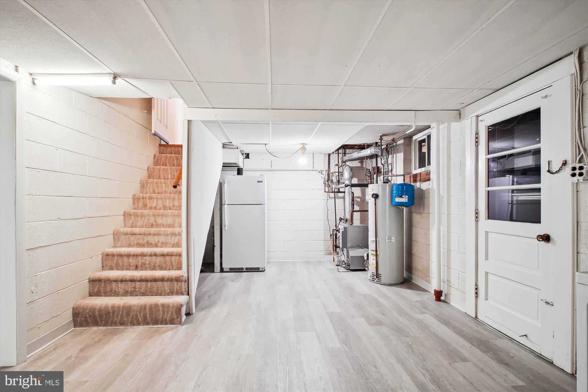10607 Judicial Drive Fairfax, VA 22030 - Photo 50 of 60 a view of empty room with wooden floor and stairs