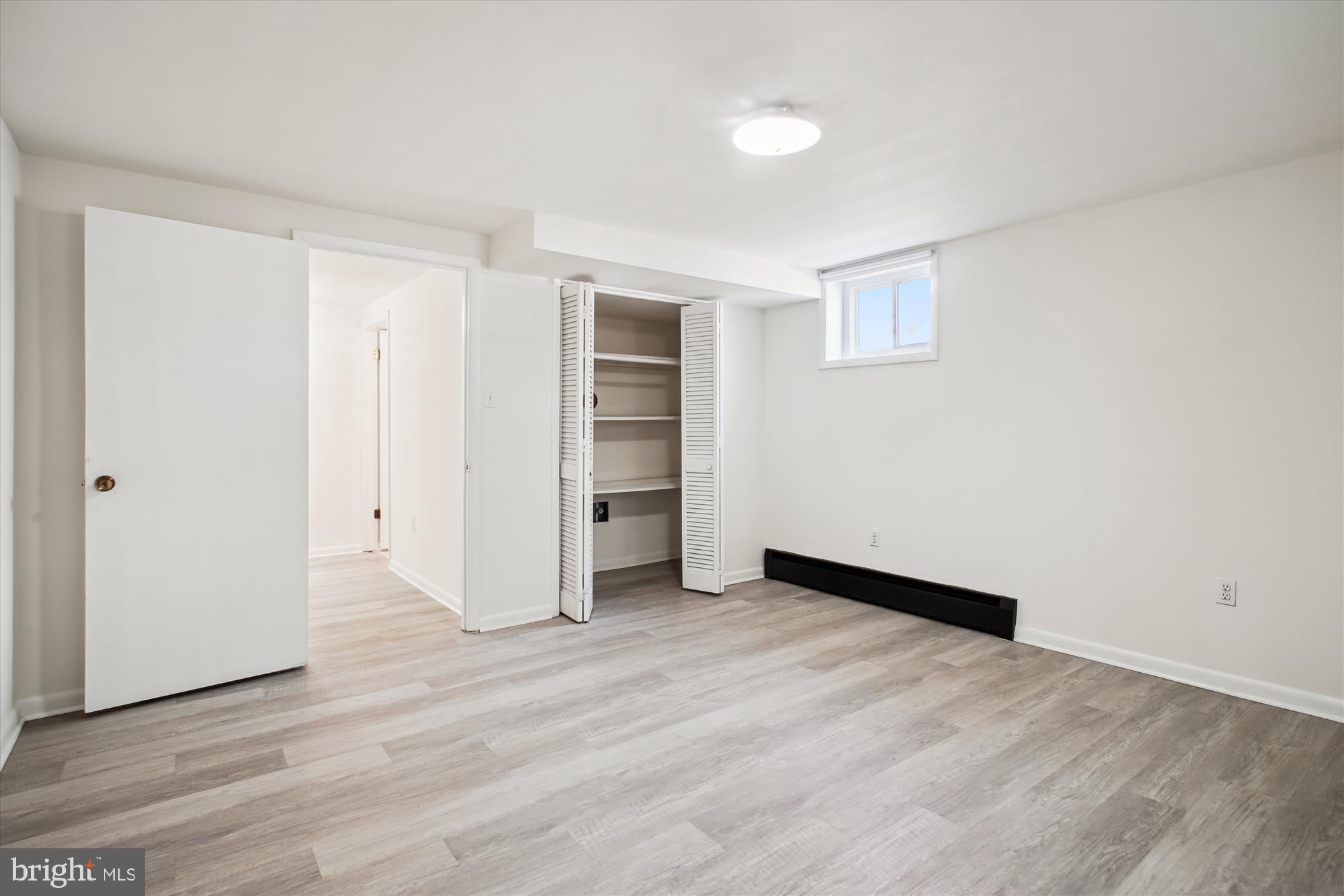 10607 Judicial Drive Fairfax, VA 22030 - Photo 57 of 60 an empty room with wooden floor