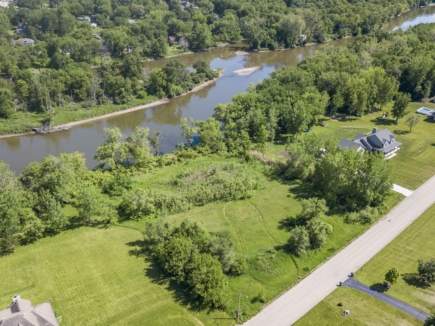 5 Belle Rive Drive Millington, IL 60537 - Photo 2 of 16 an aerial view of residential houses with outdoor space and trees all around