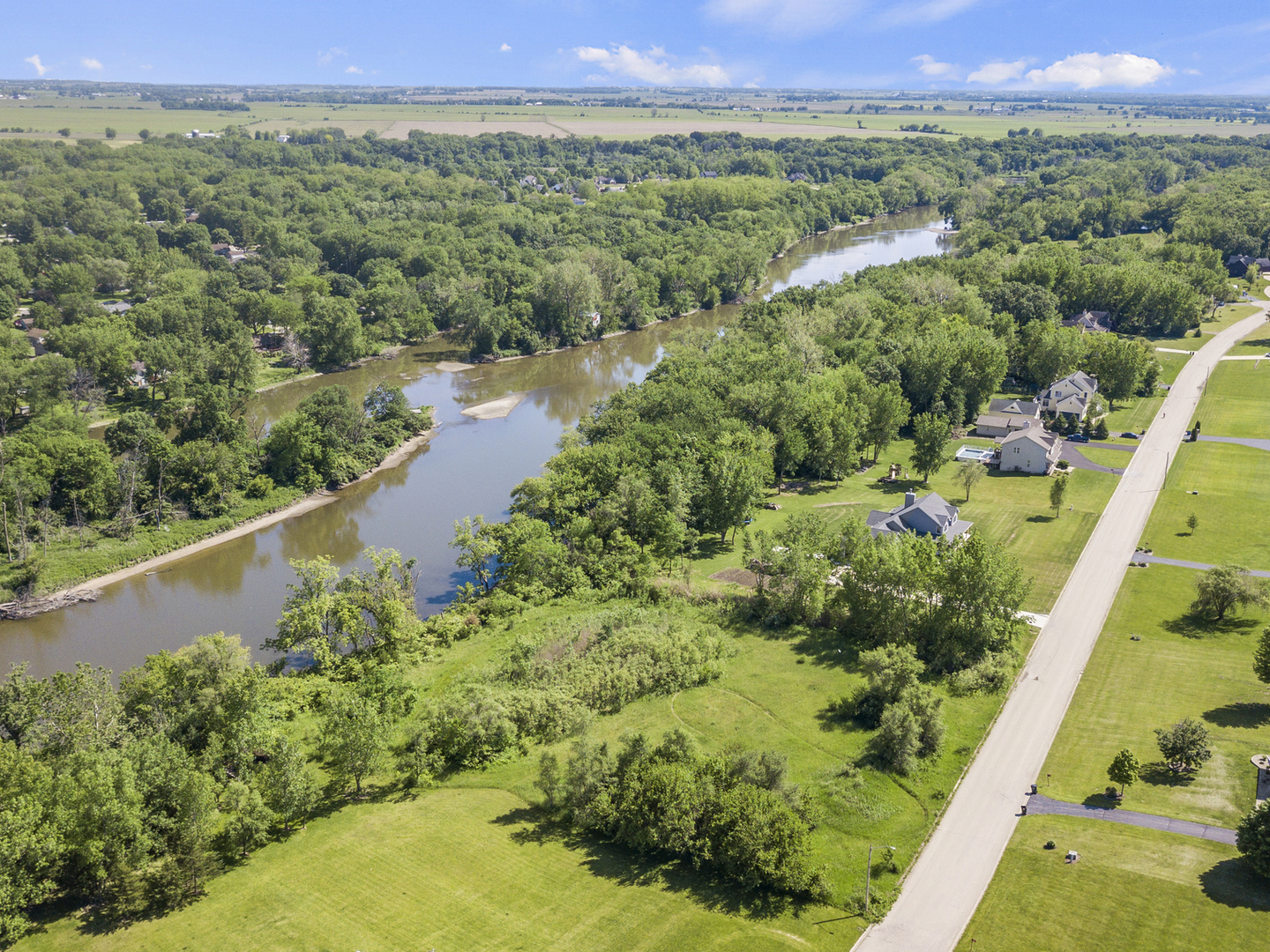 5 Belle Rive Drive Millington, IL 60537 - Photo 3 of 16 a view of a city with lush green forest