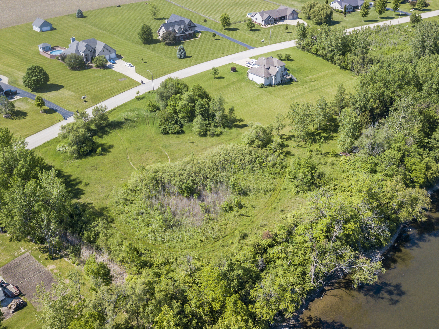 5 Belle Rive Drive Millington, IL 60537 - Photo 8 of 16 a view of a table & chairs in a garden