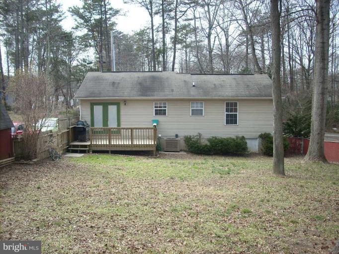 11594 Big Sandy Run Road Lusby, MD 20657 - Photo 14 of 16 a backyard of a house with lots of green space