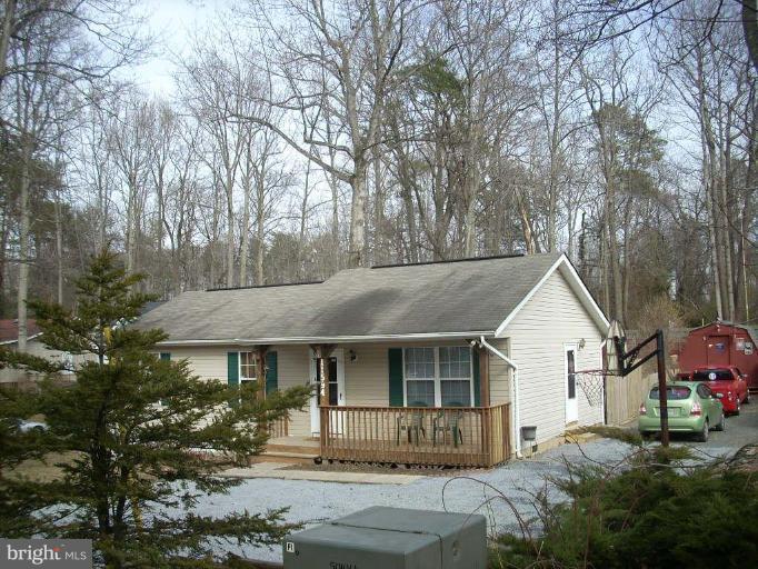 11594 Big Sandy Run Road Lusby, MD 20657 - Photo 16 of 16 a front view of a house with garden