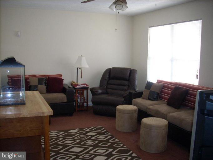 11594 Big Sandy Run Road Lusby, MD 20657 - Photo 3 of 16 a living room with furniture and a window