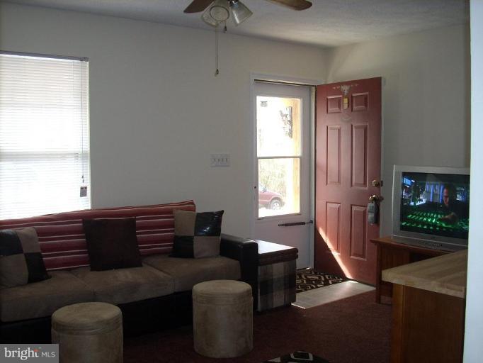 11594 Big Sandy Run Road Lusby, MD 20657 - Photo 4 of 16 a living room with furniture and a window