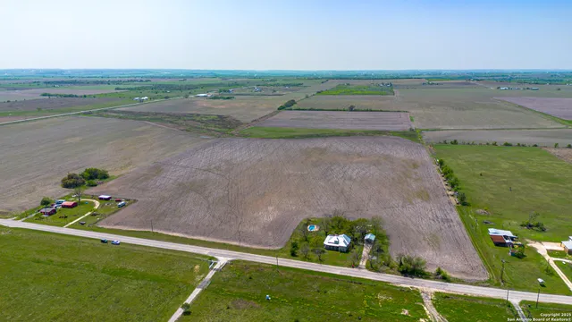 a view of a field with an ocean