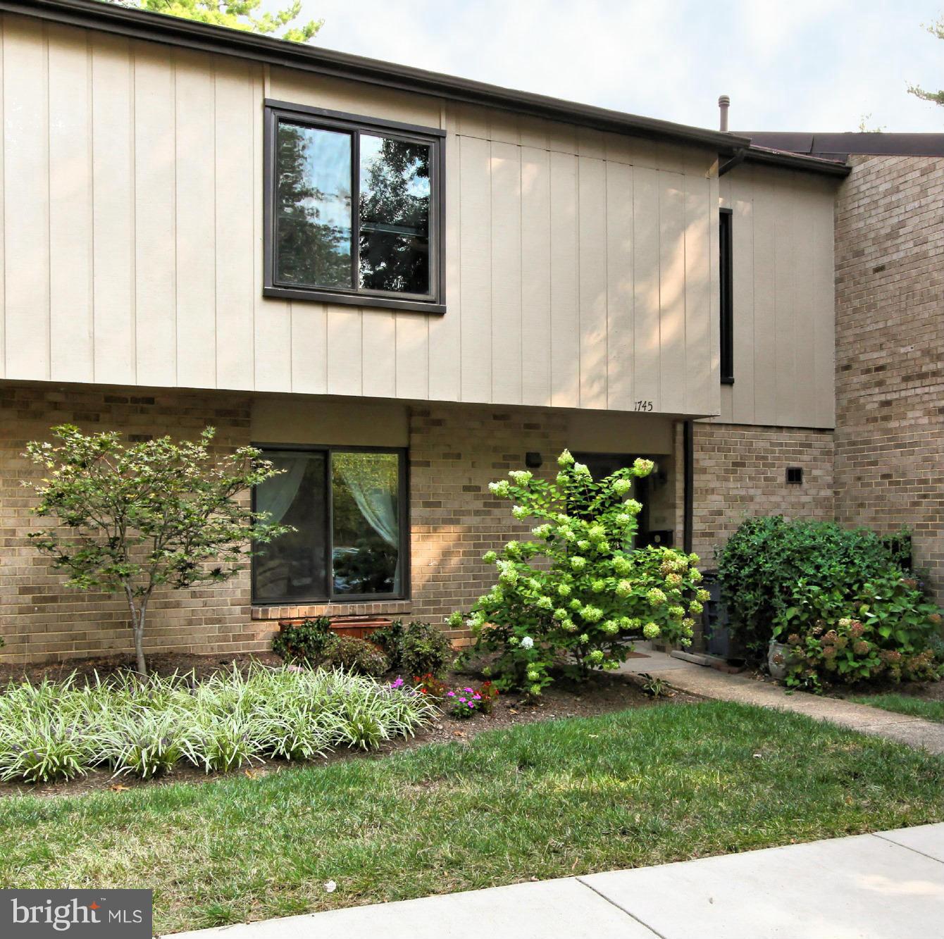 1745 Ivy Oak Square Reston, VA 20190 - Photo 1 of 30 Brick and Wood Townhome Condo