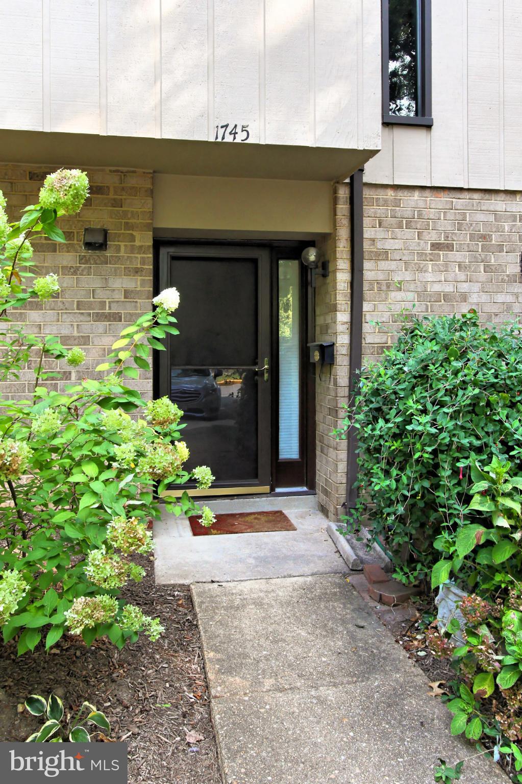 1745 Ivy Oak Square Reston, VA 20190 - Photo 3 of 30 Front Walkway to a Huge Townhome Condo