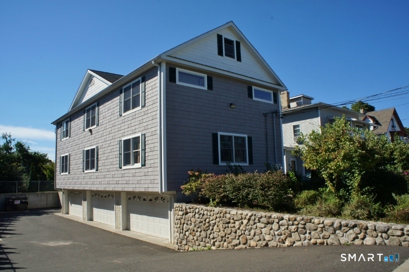 36 Chapel Street, Unit 1 Norwalk, CT 06850 - Photo 11 of 11 a front view of a house with a garden
