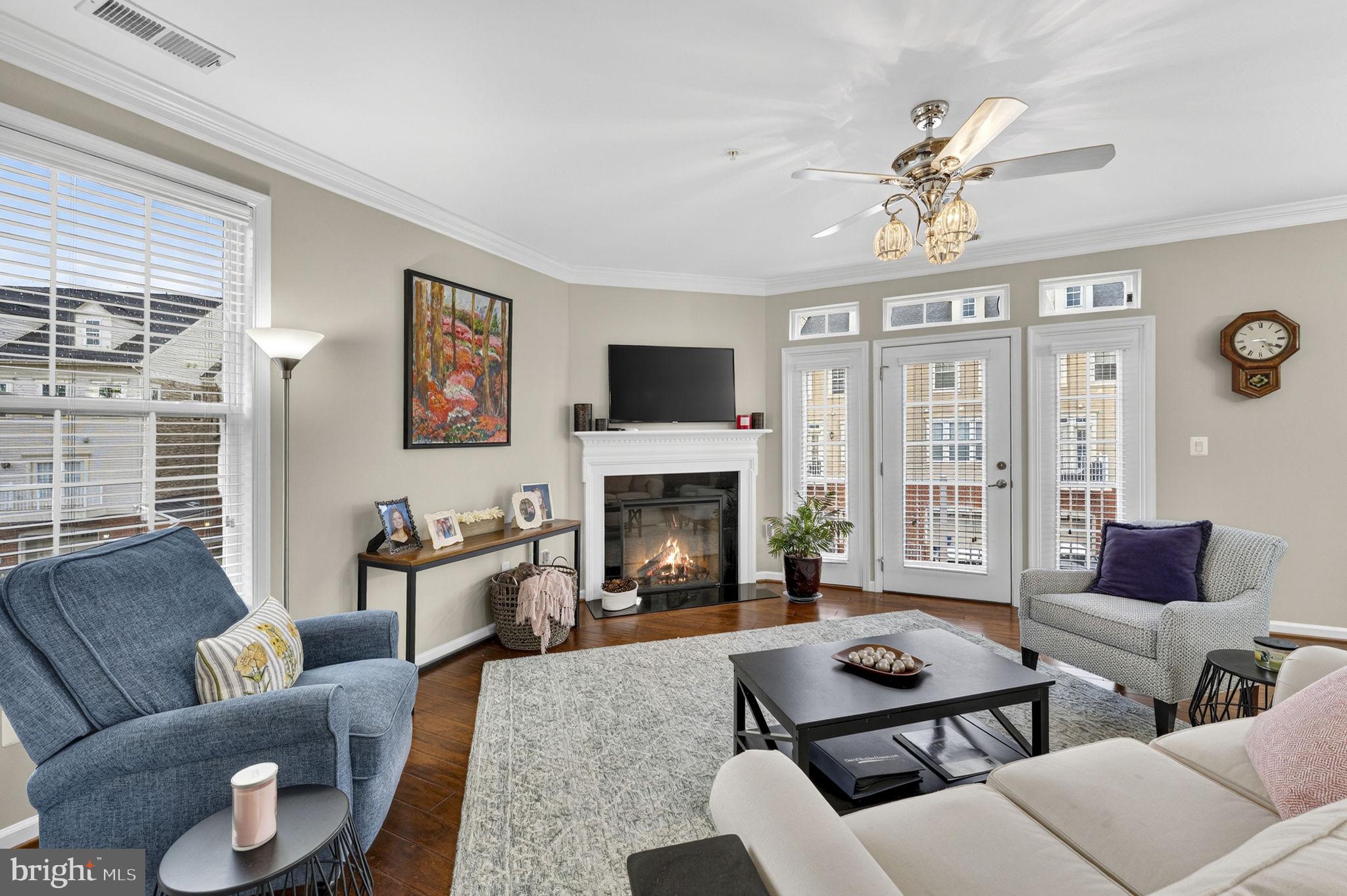 42558 Sunset Ridge Square Ashburn, VA 20148 - Photo 2 of 51 a living room with furniture fireplace and a large window