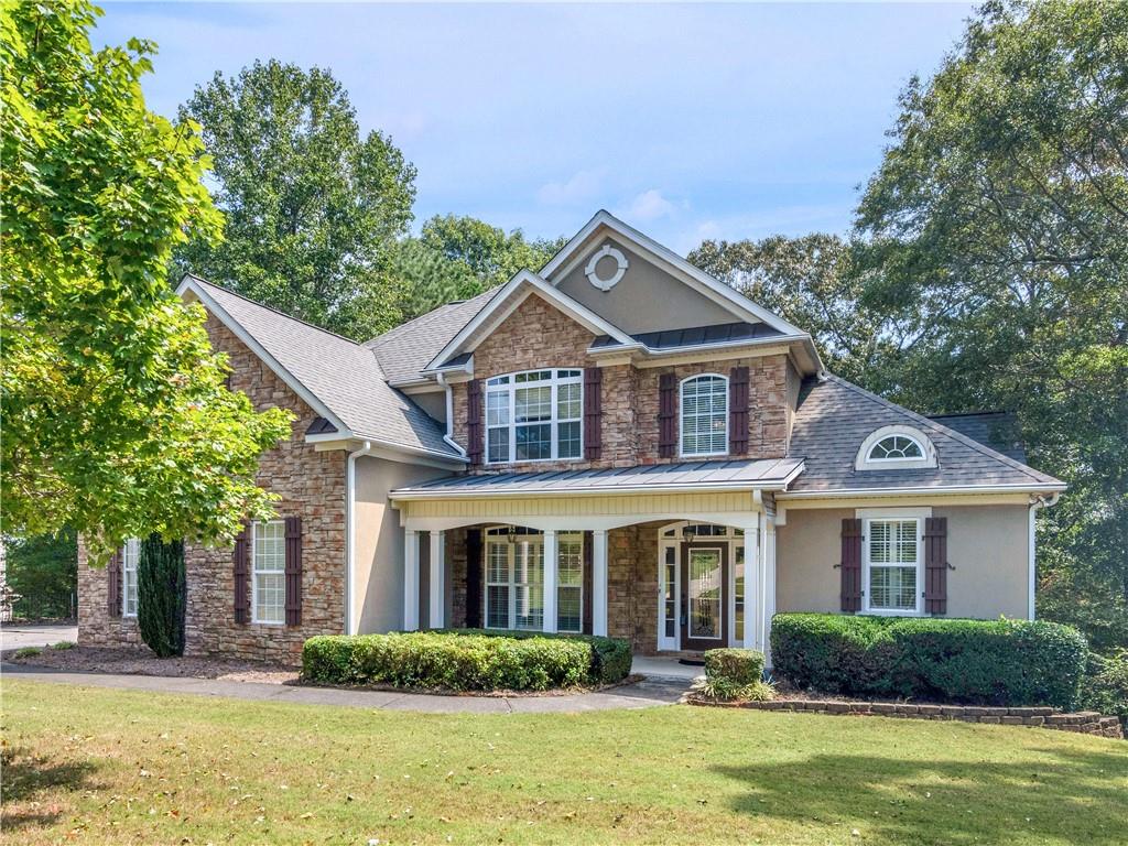 4930 Longridge Drive Villa Rica, GA 30180 - Photo 1 of 1 a front view of a house with a yard