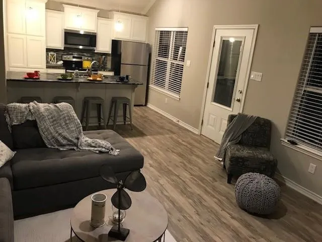 a living room with furniture and a flat screen tv