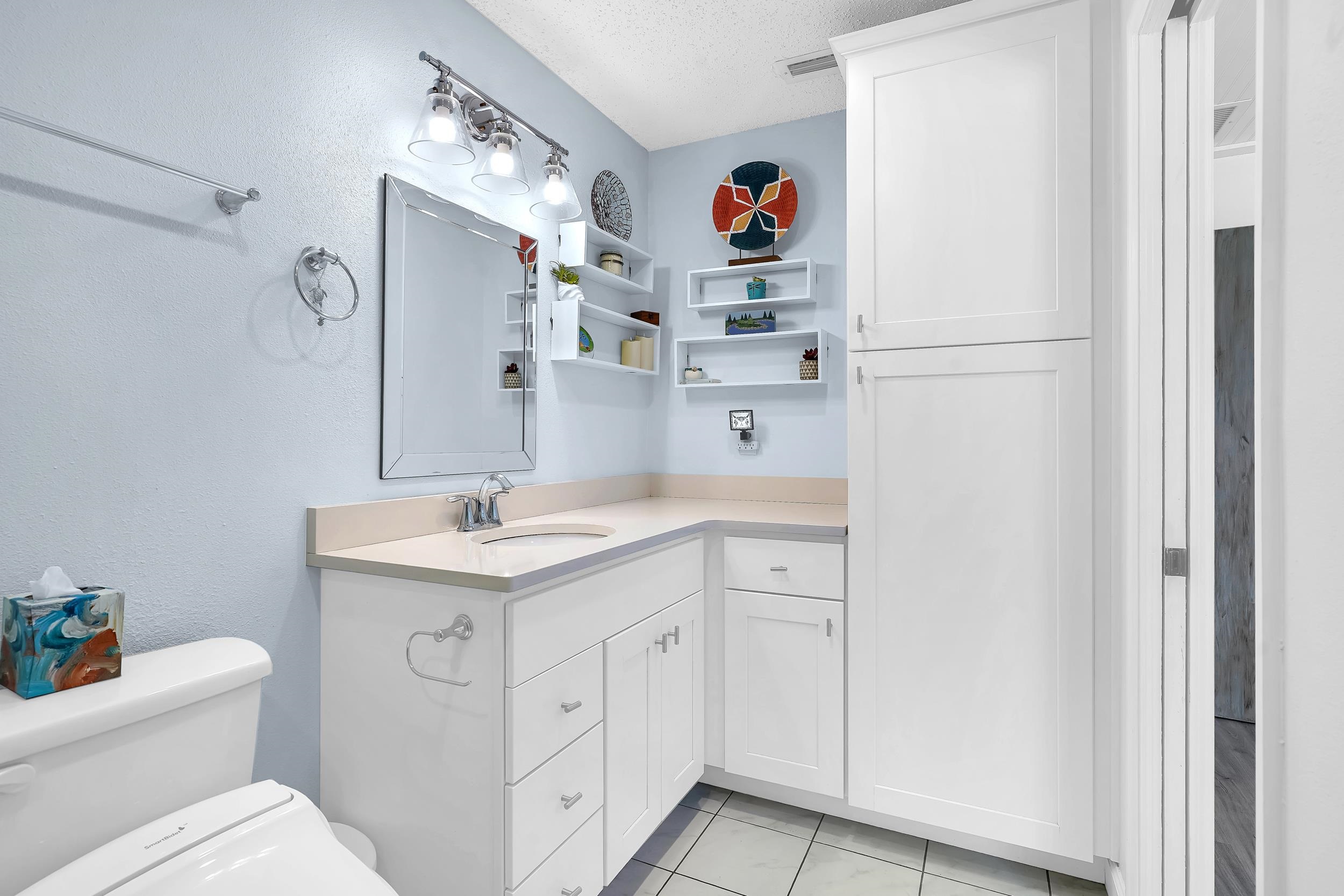 891 Wynfield Circle St. Augustine, FL 32092 - Photo 14 of 37 a bathroom with a sink toilet and a mirror