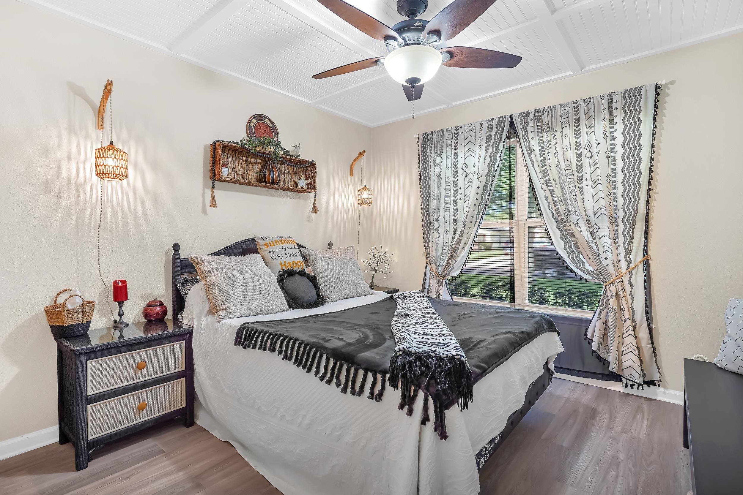 891 Wynfield Circle St. Augustine, FL 32092 - Photo 16 of 37 a bed sitting in a bedroom next to a window