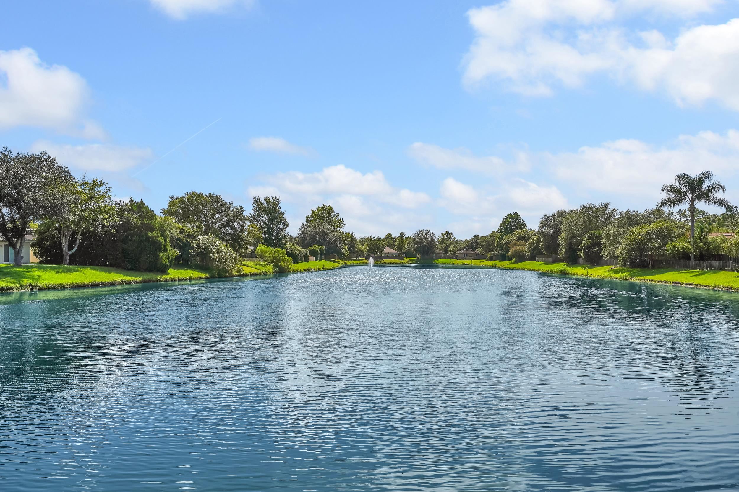 891 Wynfield Circle St. Augustine, FL 32092 - Photo 28 of 37 a view of a lake with houses in the background