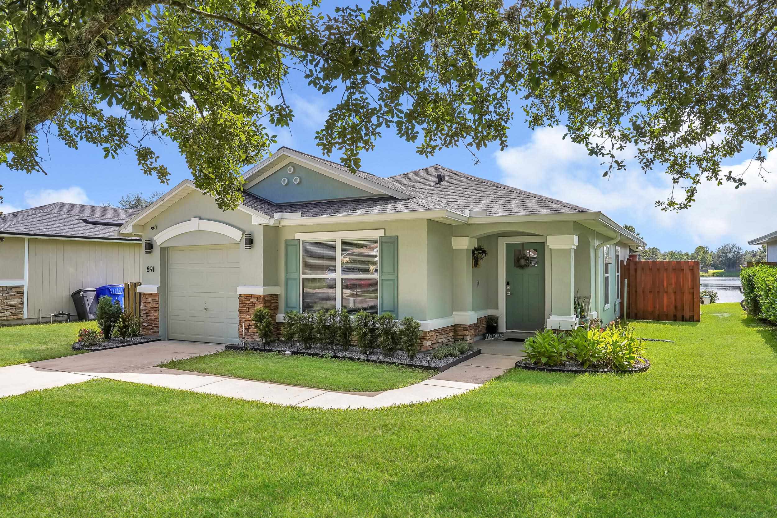 891 Wynfield Circle St. Augustine, FL 32092 - Photo 33 of 37 a front view of a house with garden