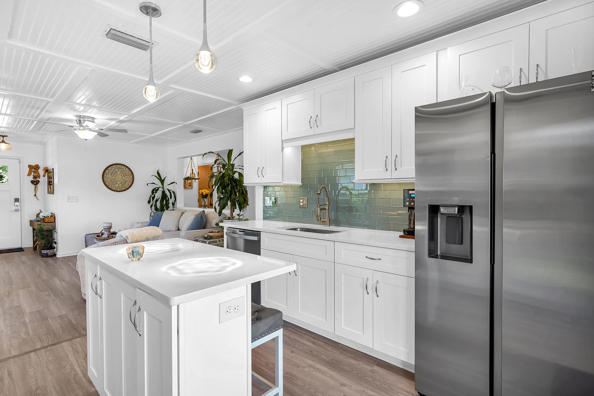 891 Wynfield Circle St. Augustine, FL 32092 - Photo 9 of 37 a kitchen with a refrigerator a sink and cabinets
