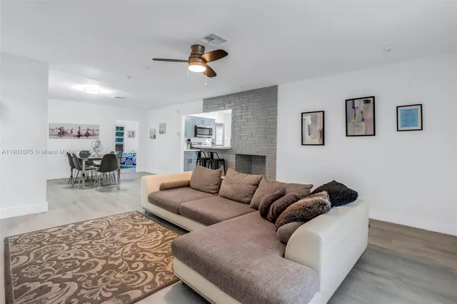 a living room with furniture and a rug