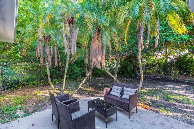 a view of a backyard with a patio