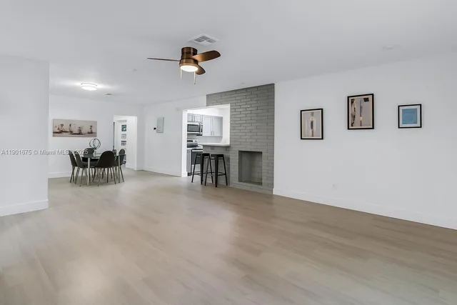 a view of livingroom with furniture and windows