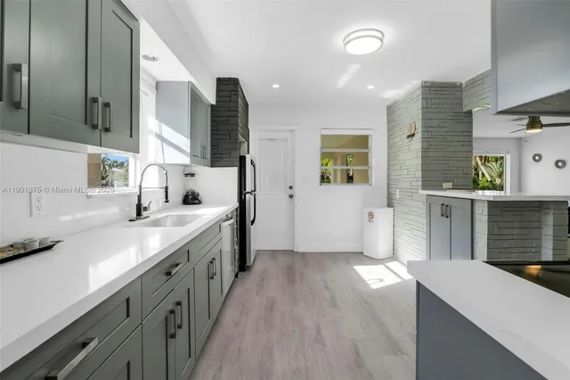 a spacious bathroom with a double vanity sink a mirror and a bathtub