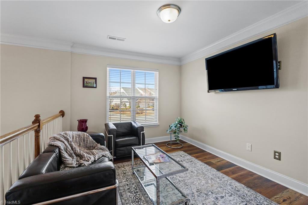 3464 Basalt Court High Point, NC 27265 - Photo 21 of 40 Versatile loft area ideal for a home office, reading lounge, media space, or workout nook — flooded with natural light.
