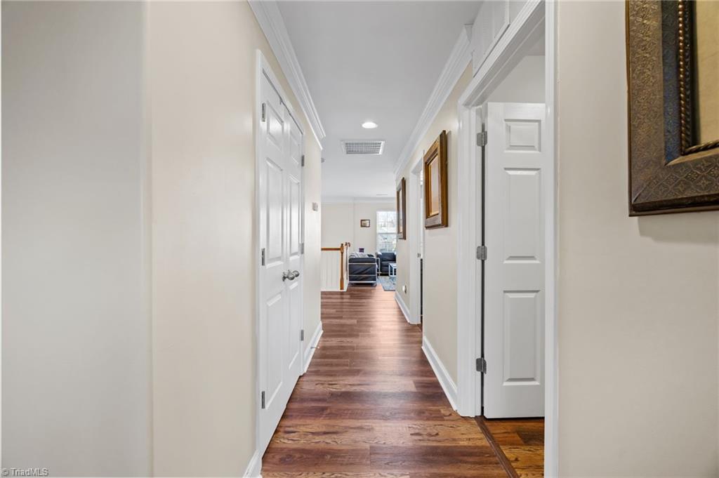 3464 Basalt Court High Point, NC 27265 - Photo 22 of 40 Updated flooring throughout the upper level creates a cohesive, modern feel with warm, rich tones.