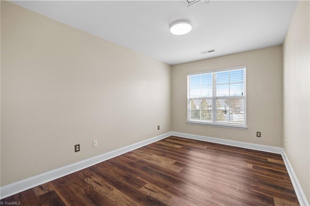 3464 Basalt Court High Point, NC 27265 - Photo 24 of 40 Spacious secondary bedroom with updated flooring, generous natural light, and flexible layout options.