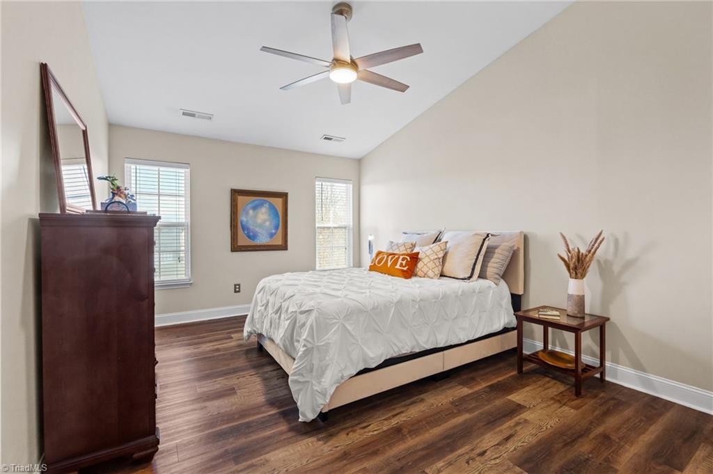 3464 Basalt Court High Point, NC 27265 - Photo 29 of 40 Oversized primary suite with vaulted ceilings, modern ceiling fan, and ample space for a king-sized bed.