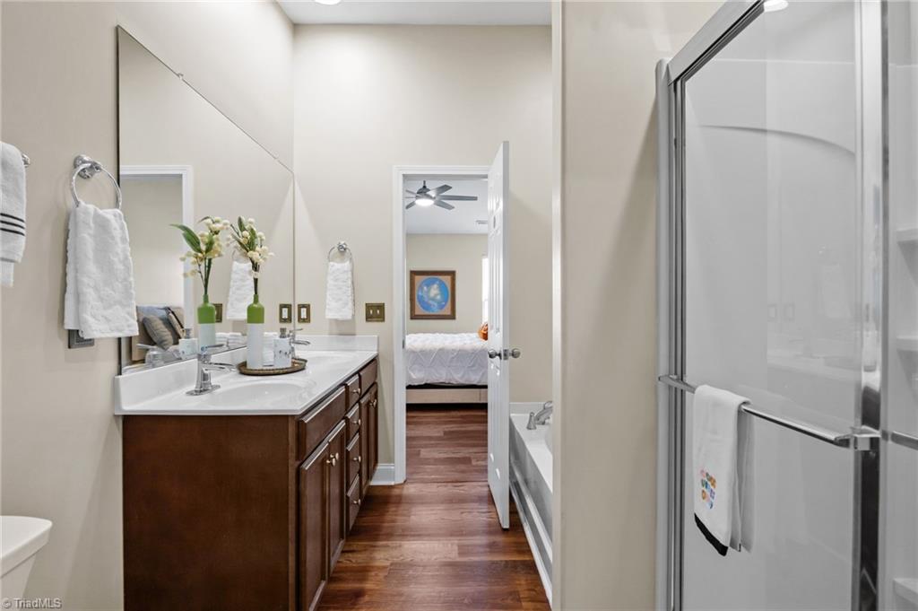 3464 Basalt Court High Point, NC 27265 - Photo 31 of 40 Primary bathroom featuring double vanity, large mirror, and abundant counter space.