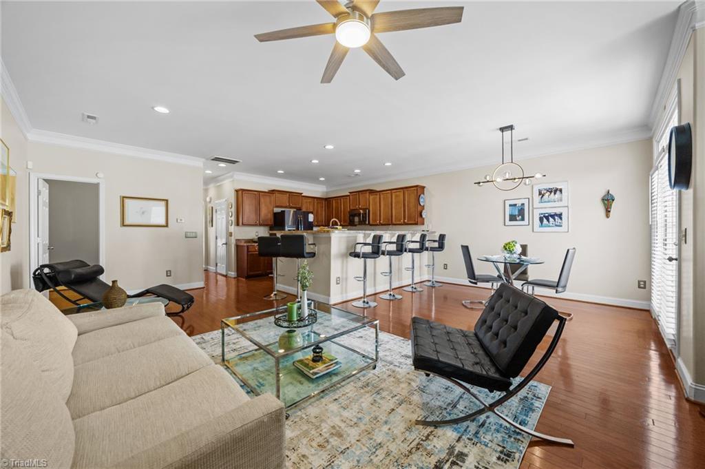 3464 Basalt Court High Point, NC 27265 - Photo 6 of 40 Spacious open-concept living room with fireplace centerpiece, a new ceiling fan and abundant natural light.