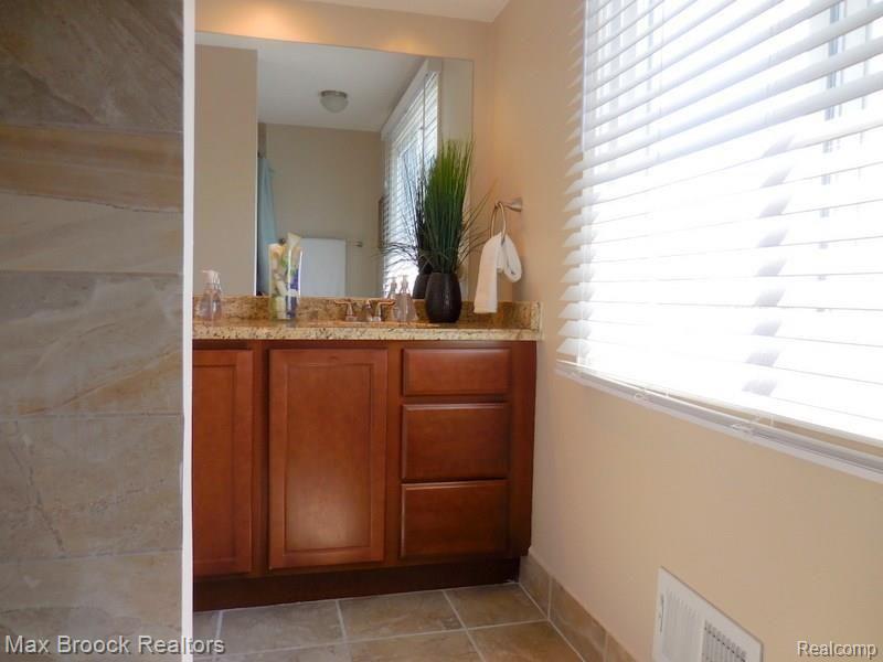25838 Branchaster Road Farmington, MI 48336 - Photo 23 of 44 CHERRY CABINETS & GRANITE TOPS