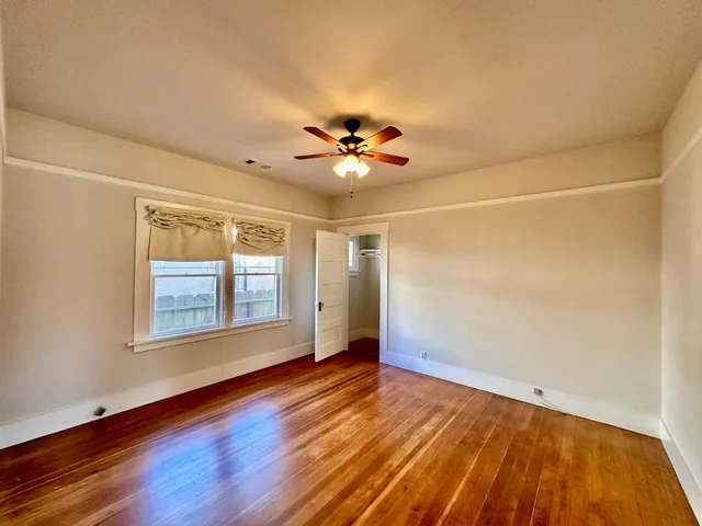 a bathroom with a bathtub a sink a mirror and shower