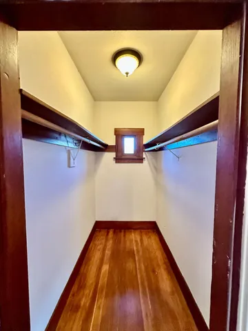 a large kitchen with stainless steel appliances granite countertop a sink and dishwasher a stove with wooden floor