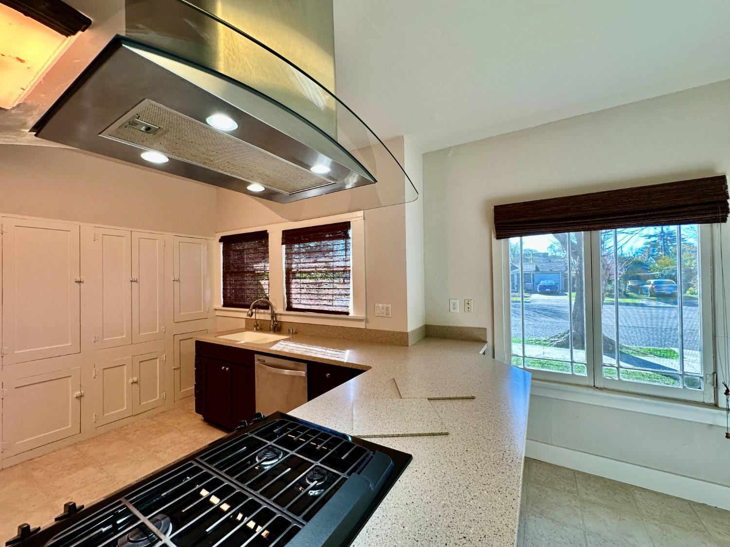 1059 Q Street Newman, CA 95360 - Photo 23 of 29 a kitchen with stainless steel appliances granite countertop a sink stove and cabinets