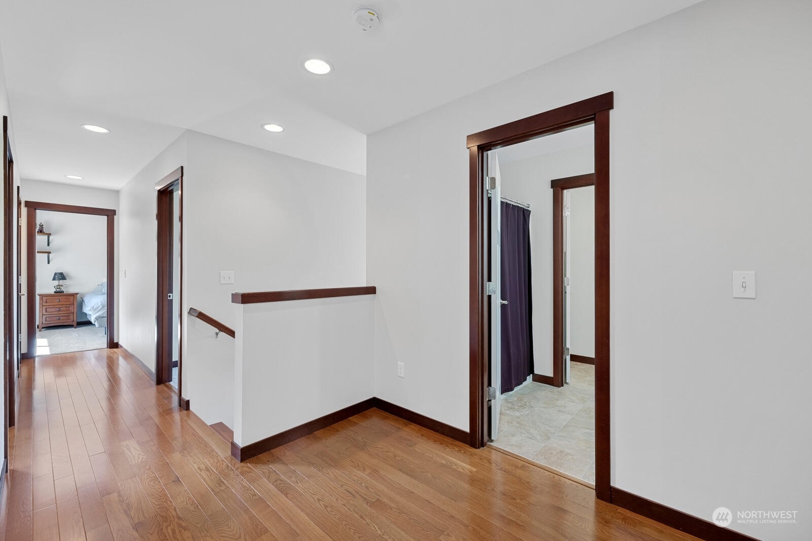 18610 Russian Road Arlington, WA 98223 - Photo 21 of 40 a view of a hallway with wooden floor