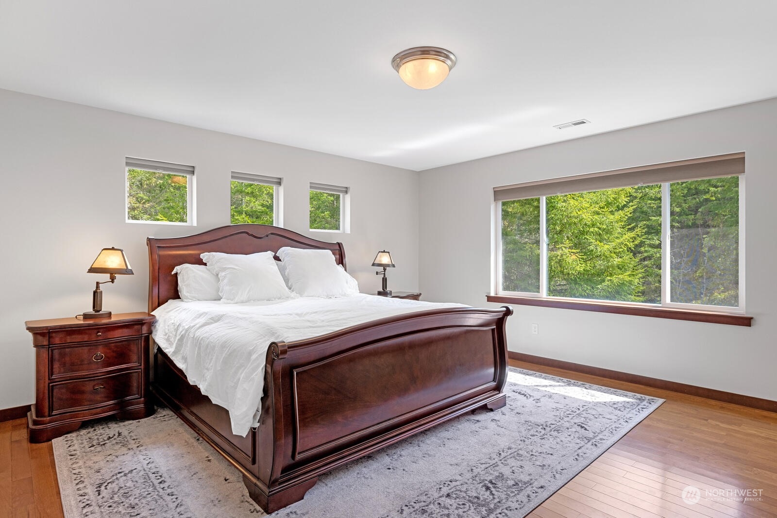 18610 Russian Road Arlington, WA 98223 - Photo 22 of 40 a bed sitting in a bedroom next to a window