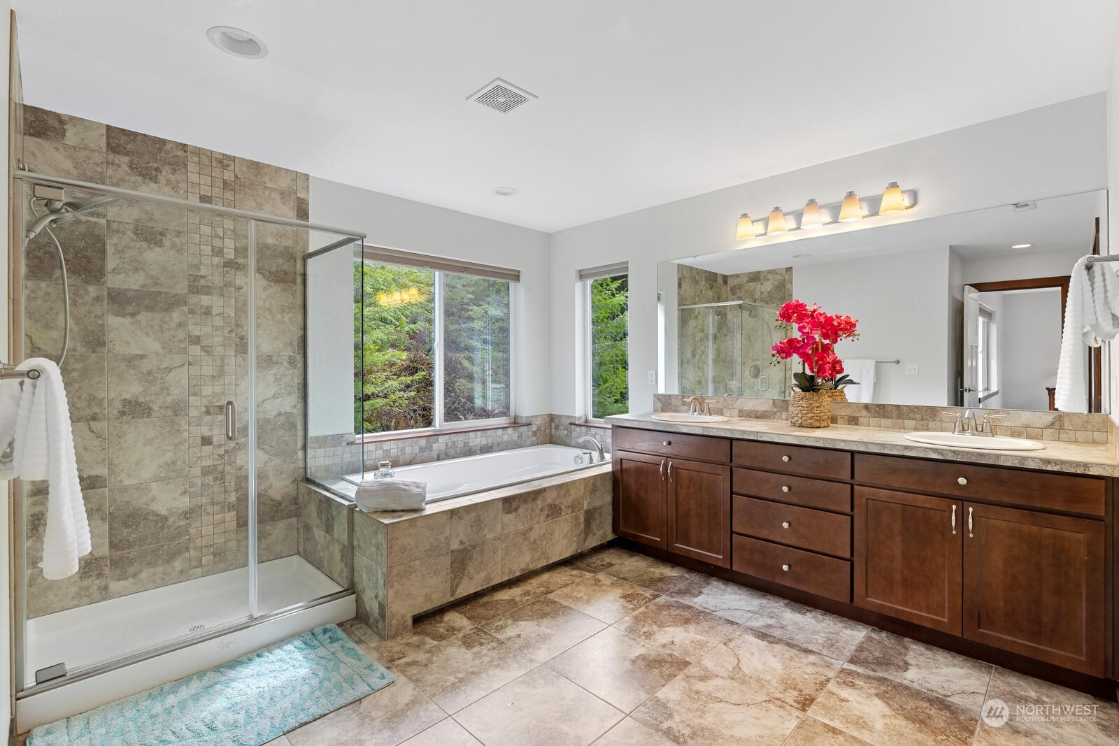 18610 Russian Road Arlington, WA 98223 - Photo 24 of 40 a spacious bathroom with a granite countertop tub sink and mirror