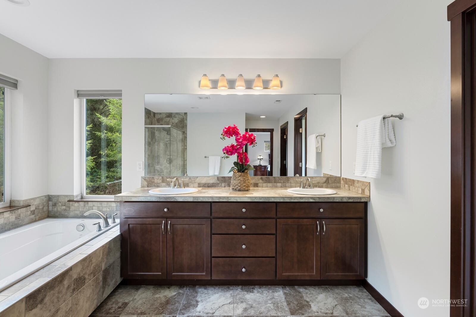 18610 Russian Road Arlington, WA 98223 - Photo 25 of 40 a bathroom with a tub sink and mirror