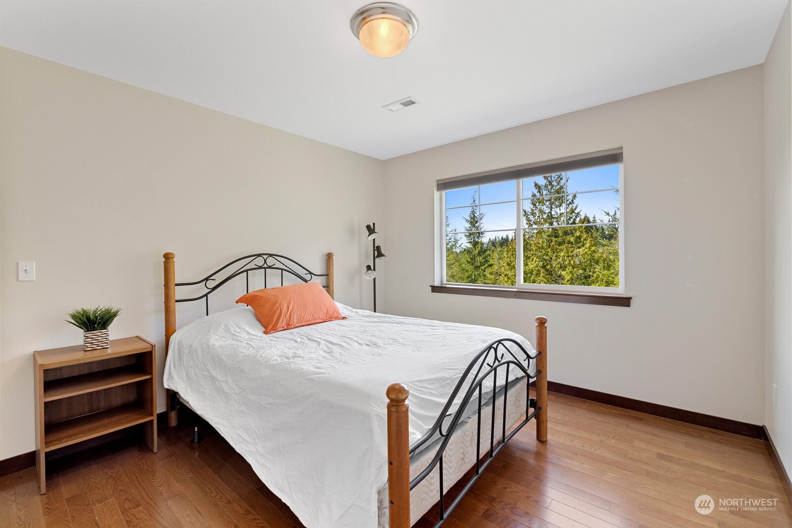 18610 Russian Road Arlington, WA 98223 - Photo 27 of 40 a bedroom with a bed and a window