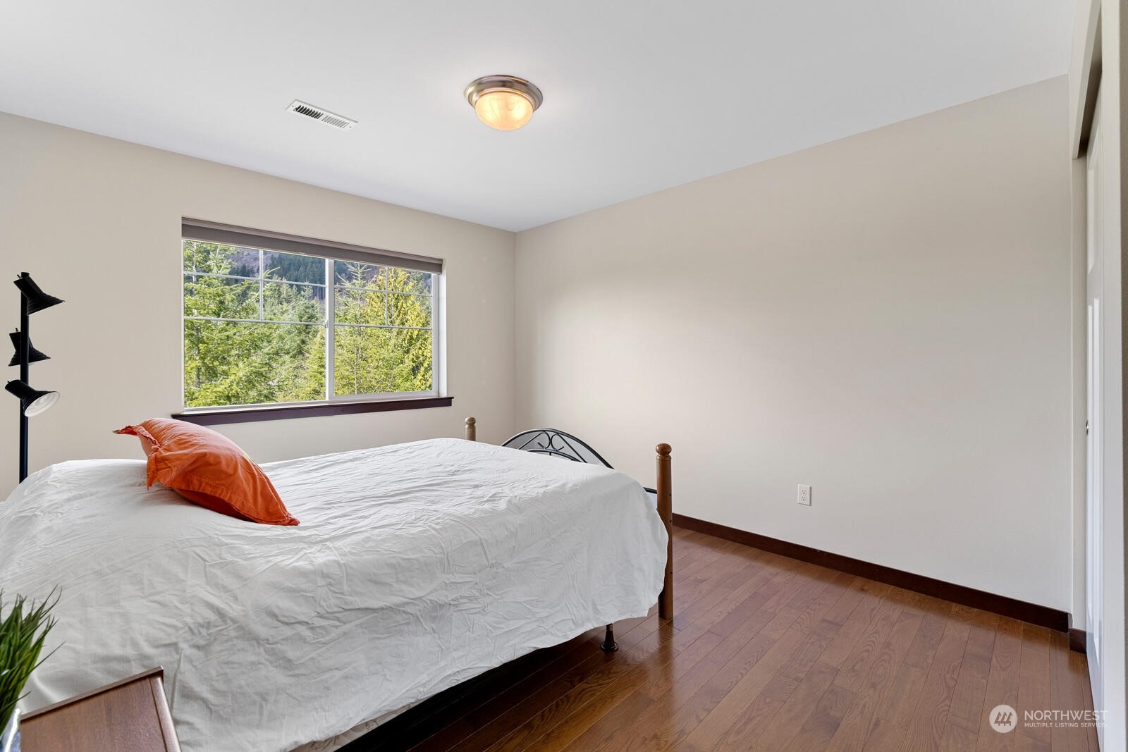 18610 Russian Road Arlington, WA 98223 - Photo 28 of 40 a bedroom with a bed and window