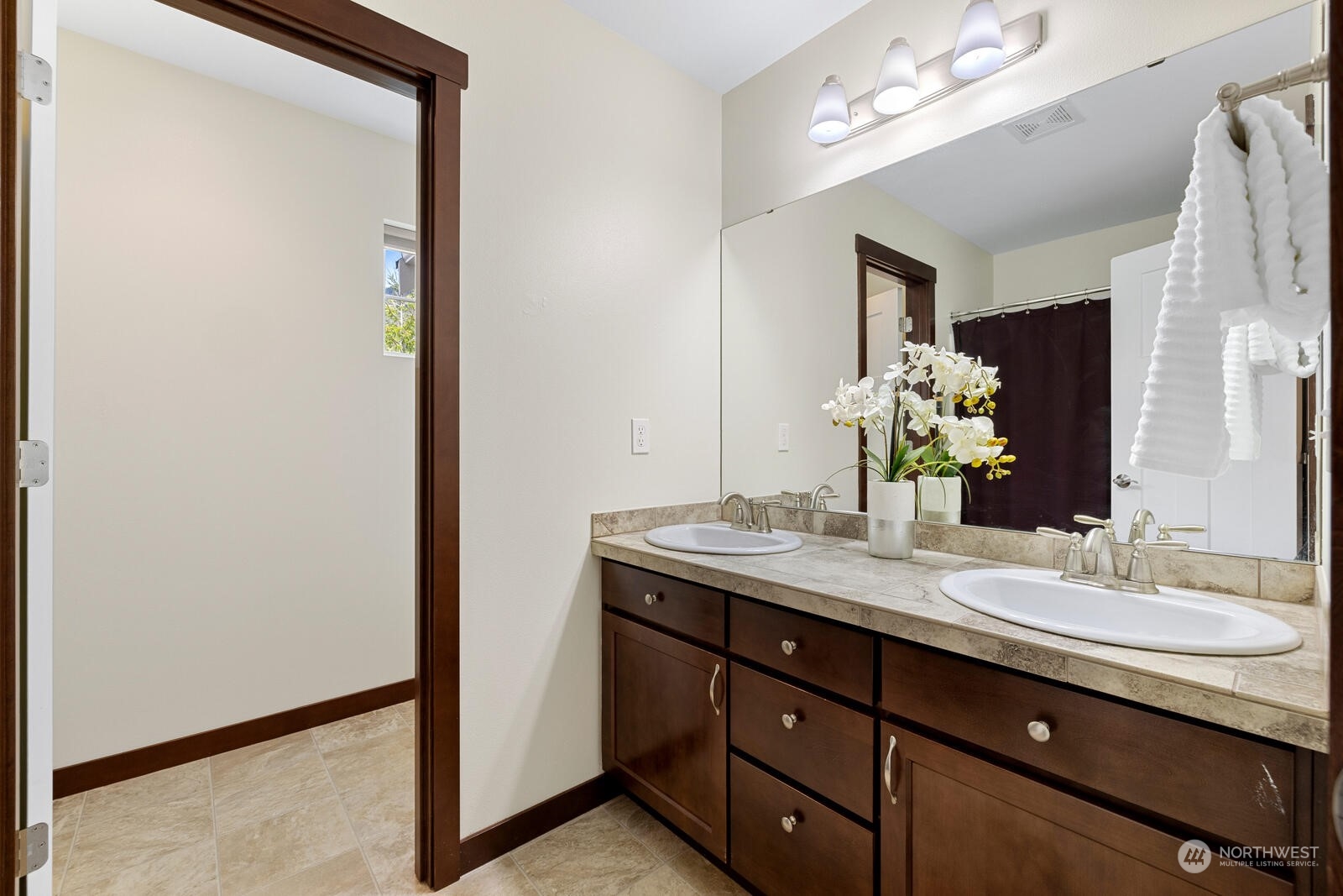 18610 Russian Road Arlington, WA 98223 - Photo 29 of 40 a bathroom with a granite countertop sink and a mirror