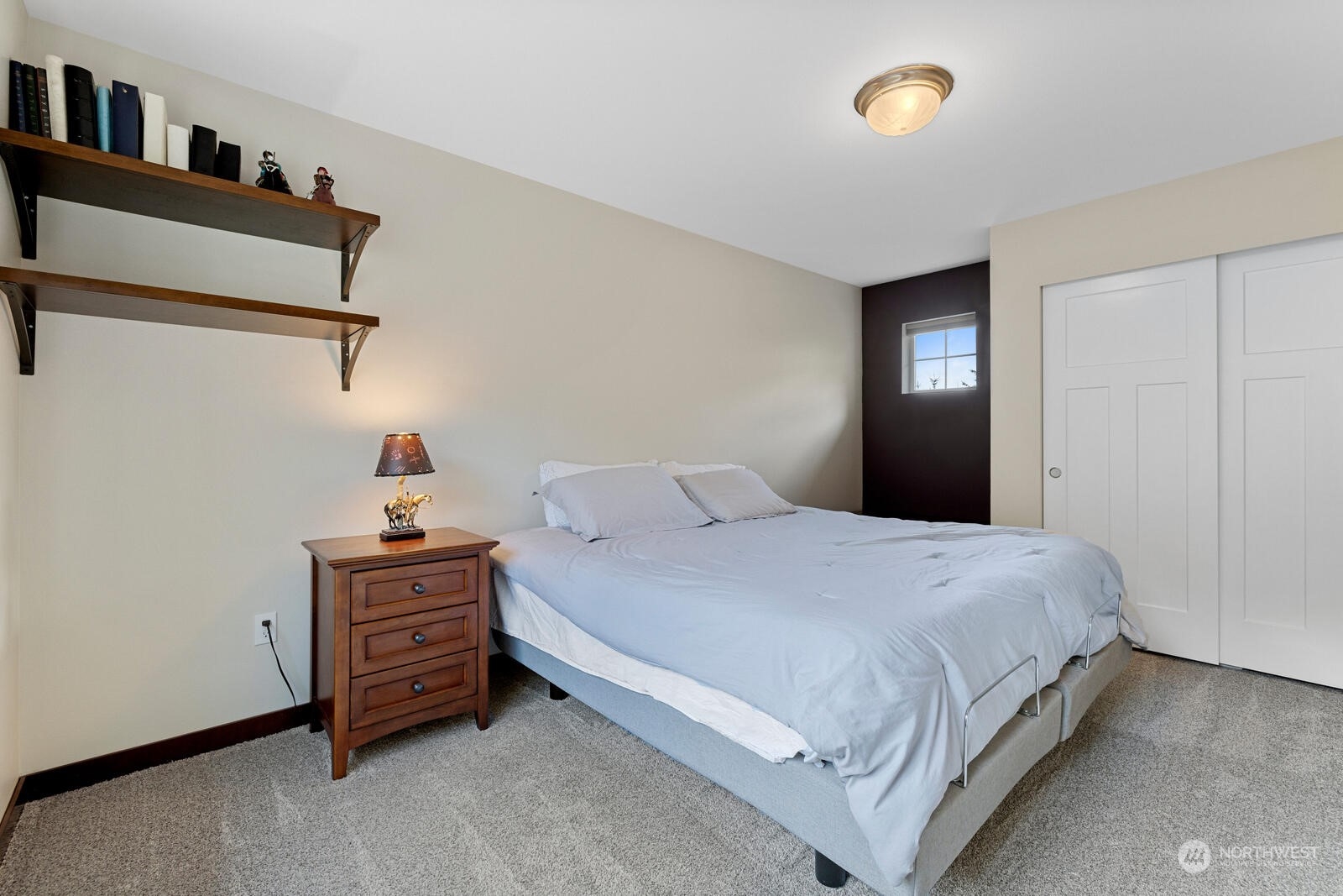 18610 Russian Road Arlington, WA 98223 - Photo 30 of 40 a bedroom with a bed and a cabinets