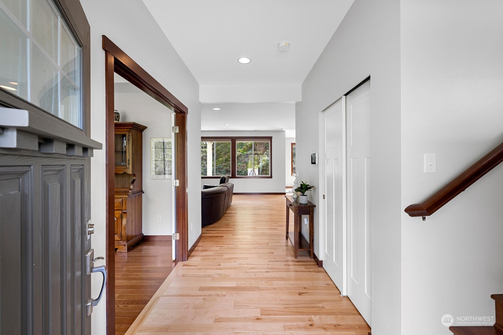 18610 Russian Road Arlington, WA 98223 - Photo 4 of 40 a view of a hallway with wooden floor and staircase