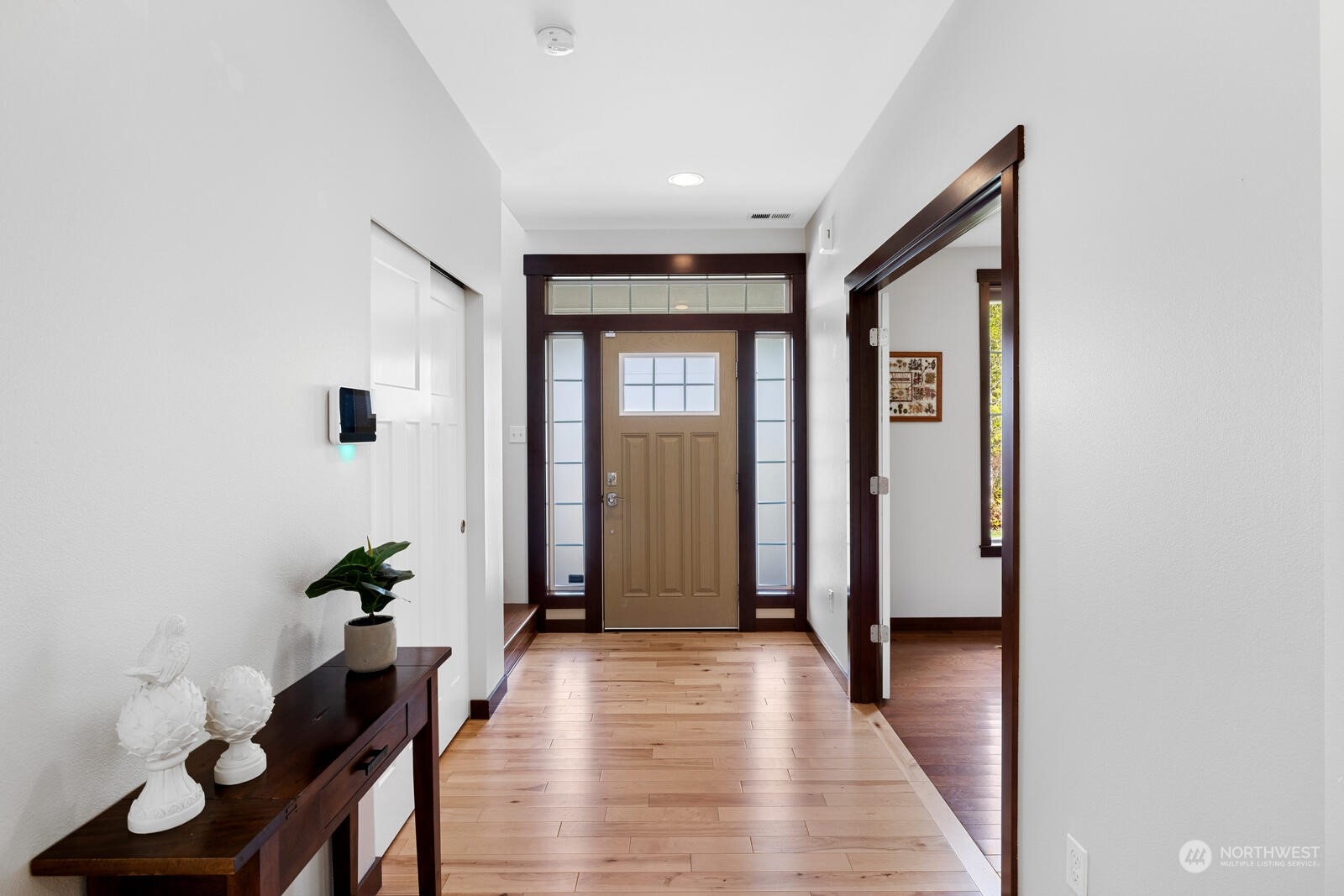 18610 Russian Road Arlington, WA 98223 - Photo 5 of 40 a view of a hallway with wooden floor and furniture