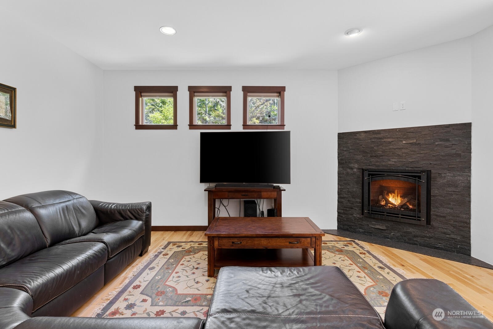 18610 Russian Road Arlington, WA 98223 - Photo 9 of 40 a living room with furniture and a fireplace
