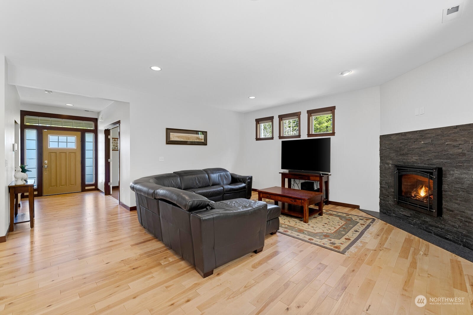18610 Russian Road Arlington, WA 98223 - Photo 10 of 40 a living room with furniture and a flat screen tv
