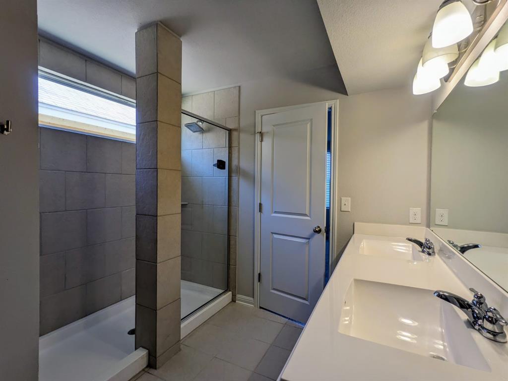 196 Martha Lane Kyle, TX 78640 - Photo 17 of 30 a bathroom with a tub and shower