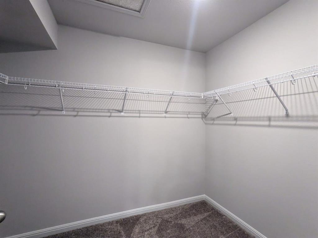 196 Martha Lane Kyle, TX 78640 - Photo 18 of 30 a view of a room with racks on the wall